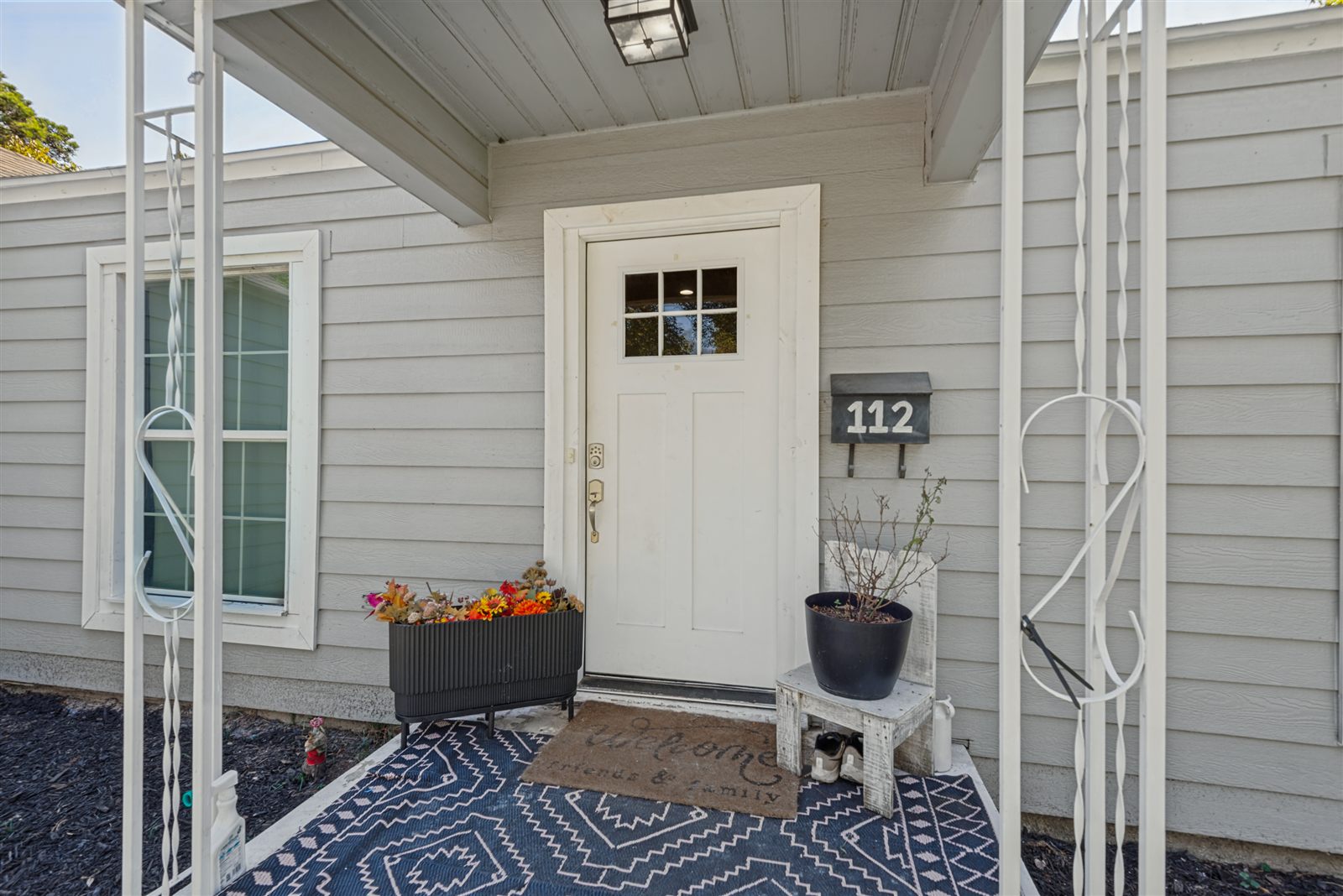Covered front porch and entry door