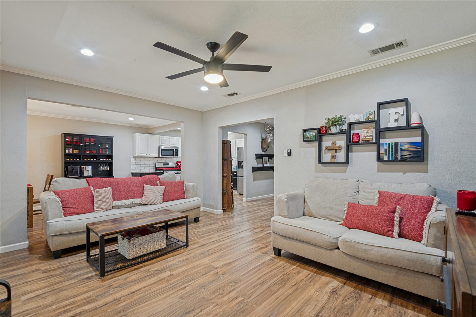 Living room opening to the kitchen and dining