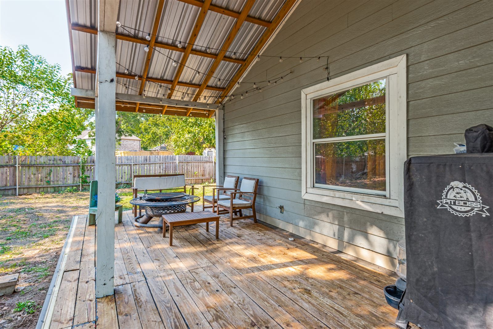 Covered back deck overlooking the yard
